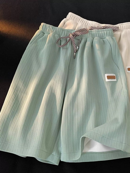 Plus Size Checkerboard Drawstring Casual Shorts - Green shorts with Apricot shorts behind - View 1
