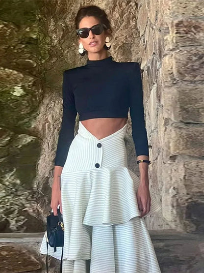 Fashionable high necked long sleeved top with ruffled edges and layered high waisted long skirt set