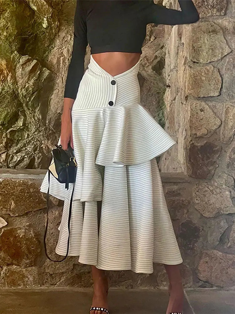 Fashionable high necked long sleeved top with ruffled edges and layered high waisted long skirt set