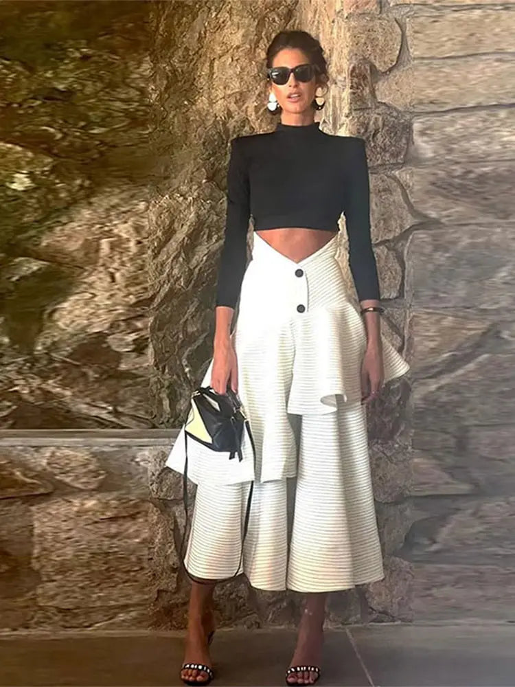 Fashionable high necked long sleeved top with ruffled edges and layered high waisted long skirt set