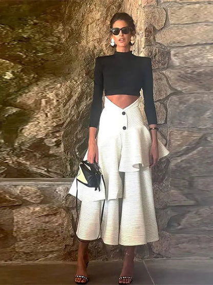 Fashionable high necked long sleeved top with ruffled edges and layered high waisted long skirt set