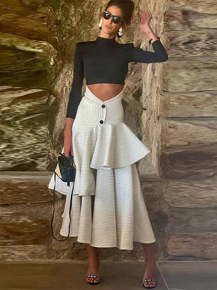 Fashionable high necked long sleeved top with ruffled edges and layered high waisted long skirt set