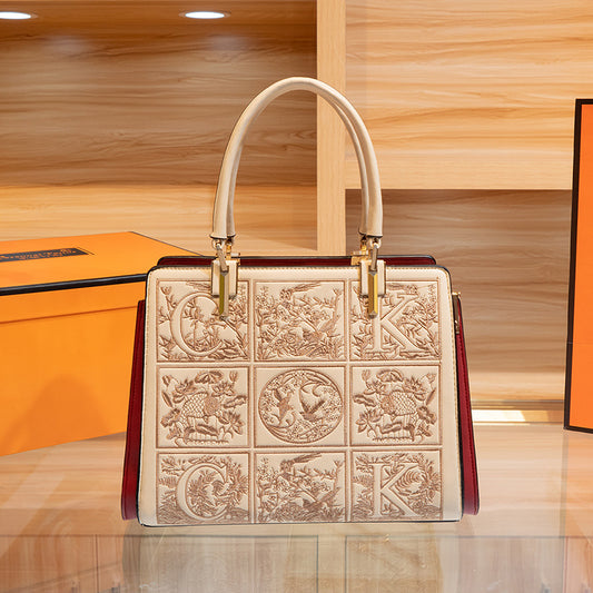 Embroidered Leather Top Handle Handbag - product photo 1