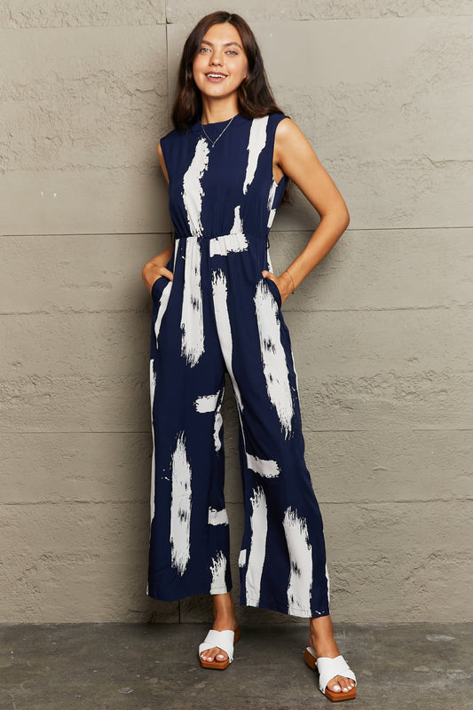 Perfee Printed Round Neck Cutout Jumpsuit with Pockets - product photo 1